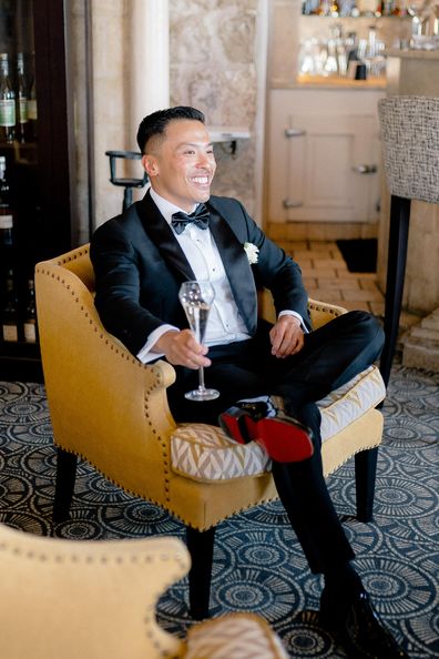 <p>At his black-tie wedding, Chilech stood out in a luxurious shawl collar tuxedo with a pleated shirt and studs, perfect for his biggest party ever.</p>